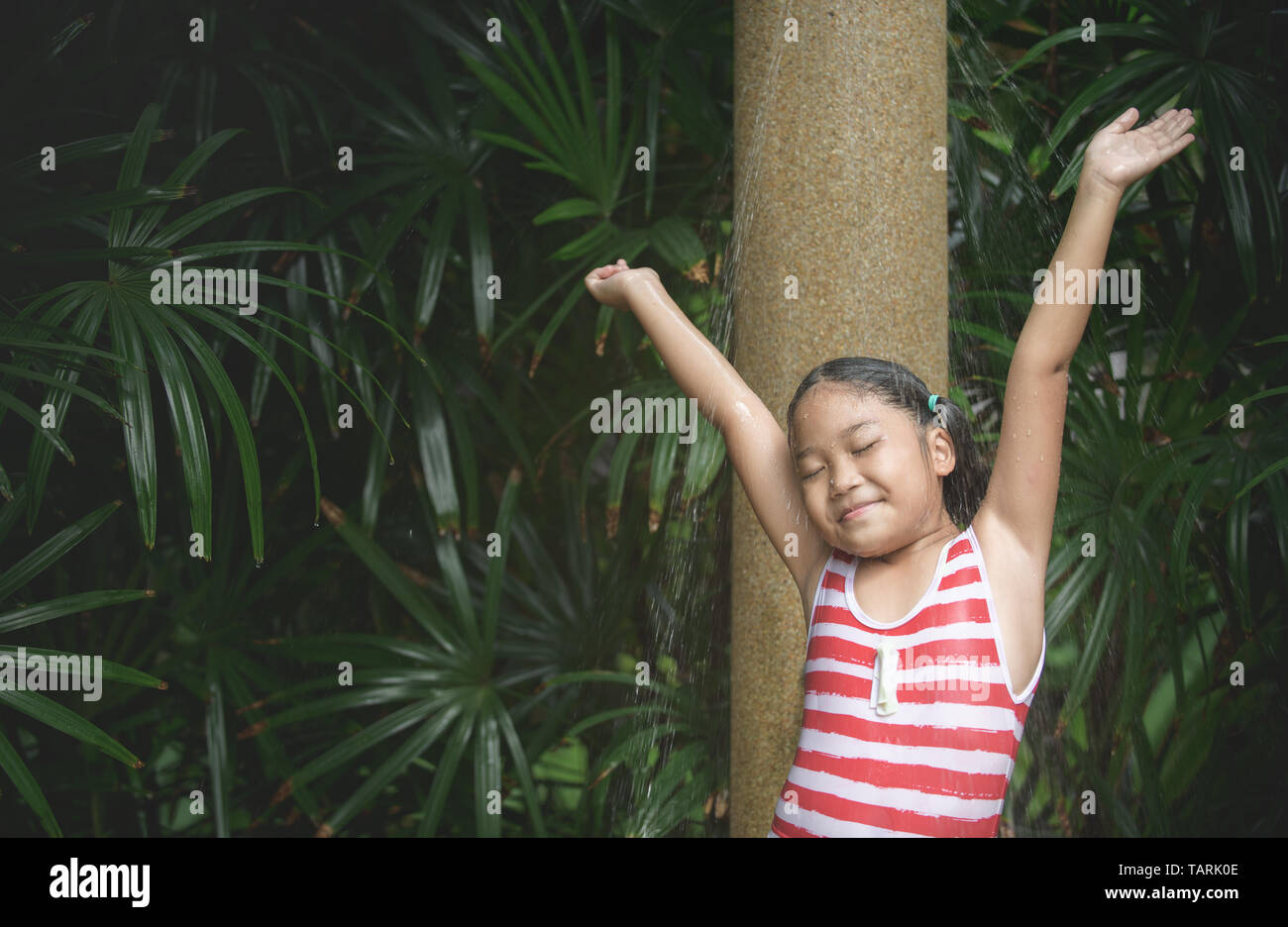 Happy cute girl taking shower before swimming, healthy and recreation