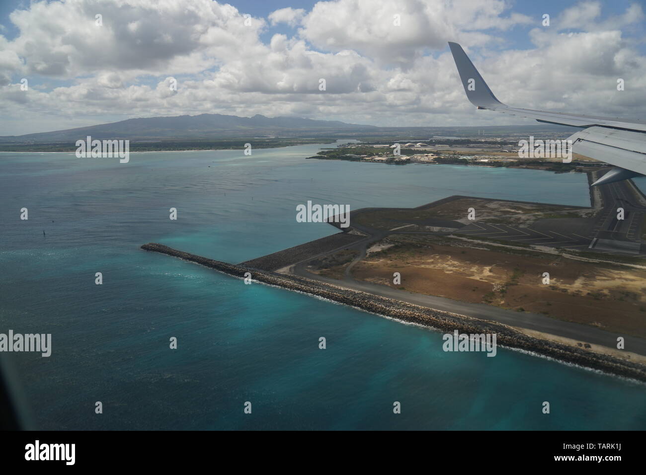 Landing at Daniel K. Inouye airport in Honolulu over crystal clear waters Stock Photo Alamy Landing at Daniel K. Inouye airport in Honolulu over crystal clear waters Stock Photo Alamy