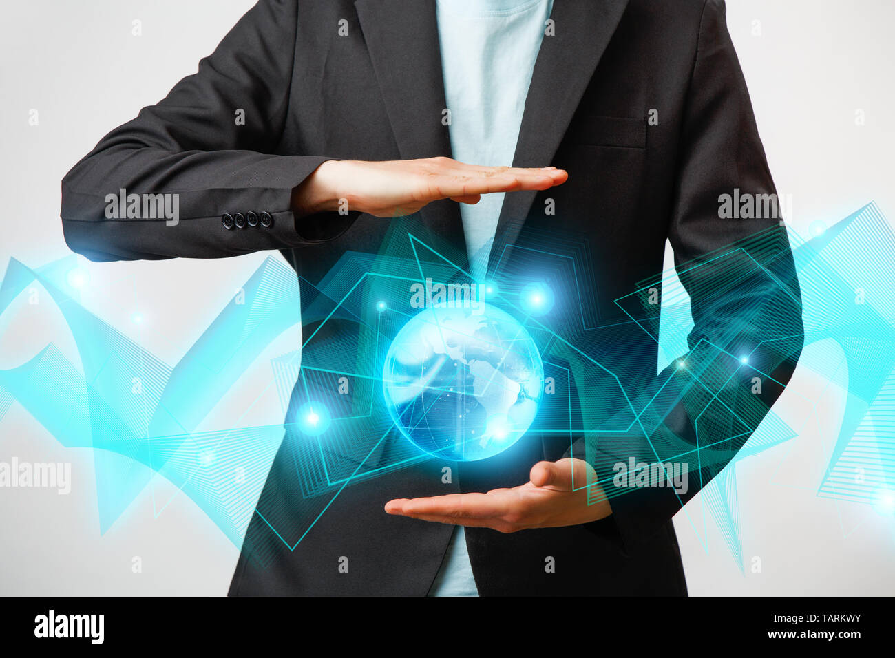 Businessman holding the glowing hologram digital globe. Concepr of ...