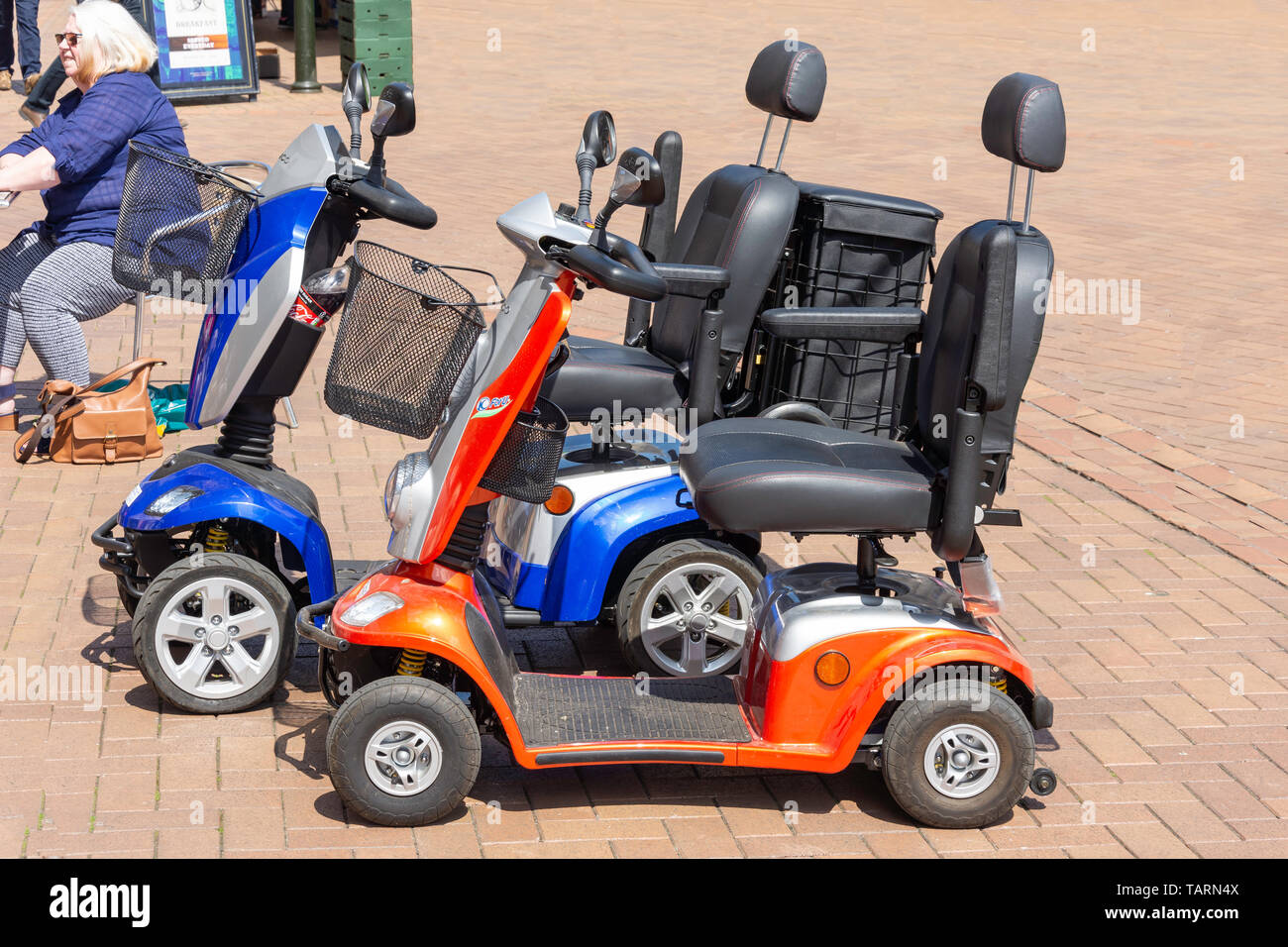 Mobility scooters parked in Market Place, Banbury, Oxfordshire, England, United Kingdom Stock Photo