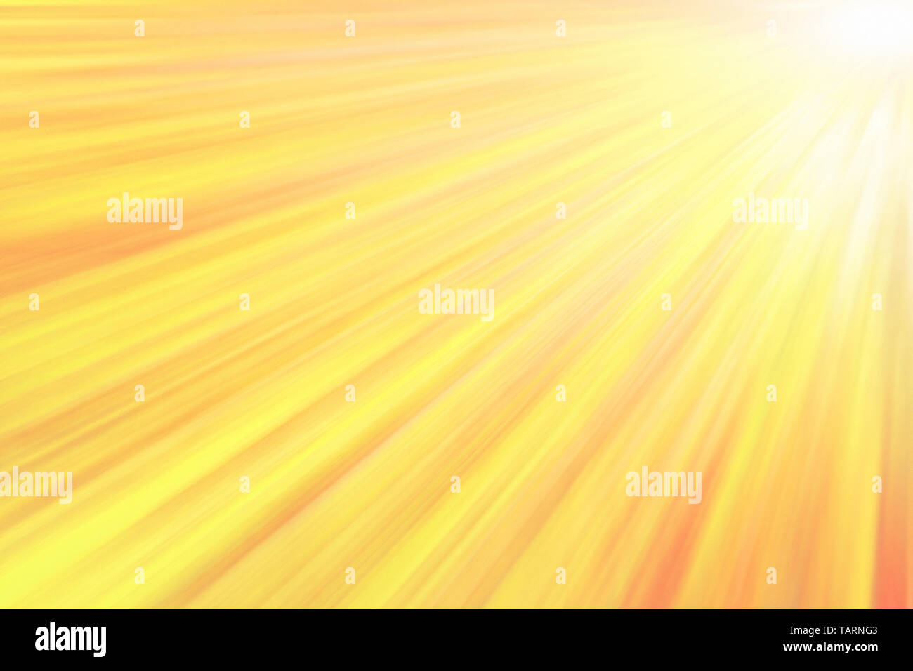 Glowing yellow sun beams. Abstract bright texture and background Stock Photo