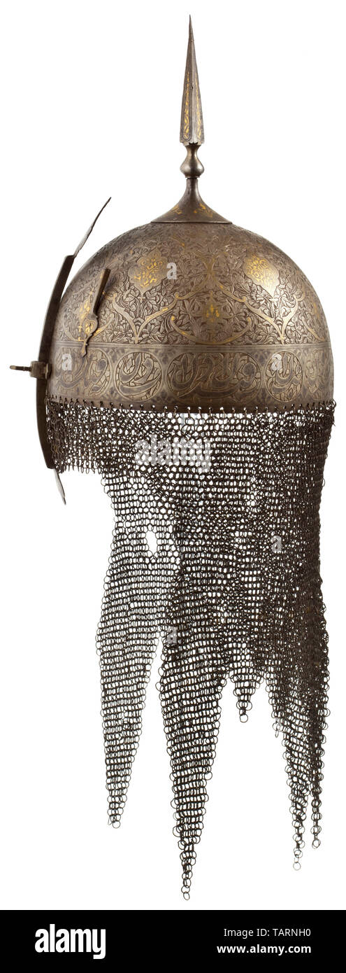 An Indo-Persian kulah khud, 19th century, One-piece skull with riveted crest plate and screwed spike of quadrangular cross section. Completely cut, floral decorations with fine gold and silver inlays (partly worn by polishing). Adjustable nasal, two riveted plume sockets on the sides. Attached to it the mail made from iron and brass rings that are not riveted (small imperfections). Height 62 cm. Persian, Orient, Oriental, Asia, Asian, historic, historical 19th century, Additional-Rights-Clearance-Info-Not-Available Stock Photo