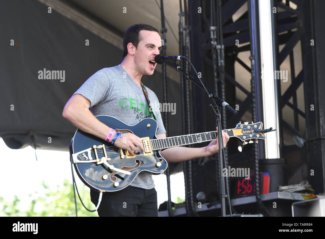 Singer, songwriter and guitarist Tom Russo is shown performing on stage during a "live" concert appearance with Rolling Blackouts Coastal Fever. Stock Photo