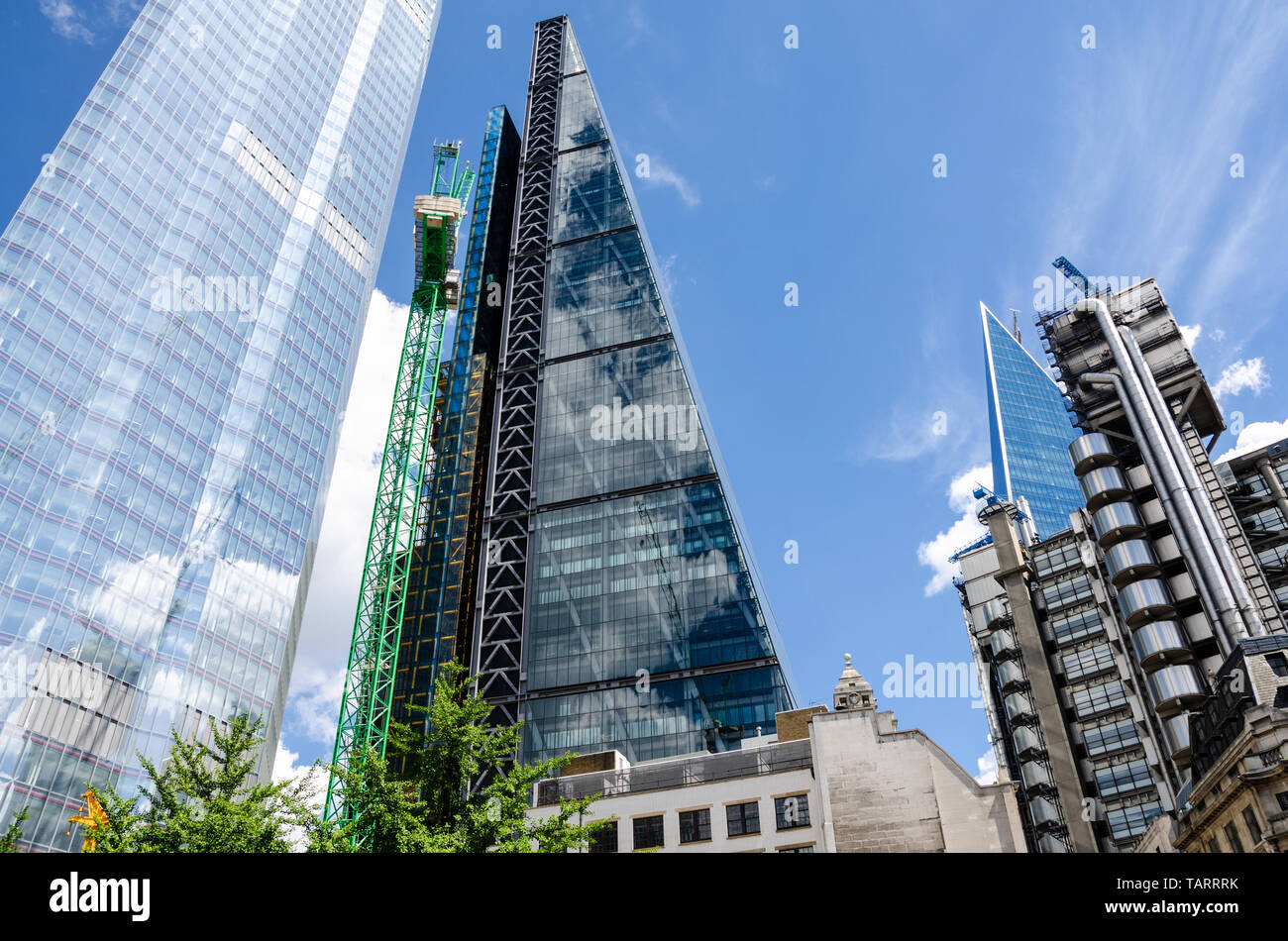 Modern skyscrapers reach into the blue sky in The Financial District of The City of London, UK Stock Photo