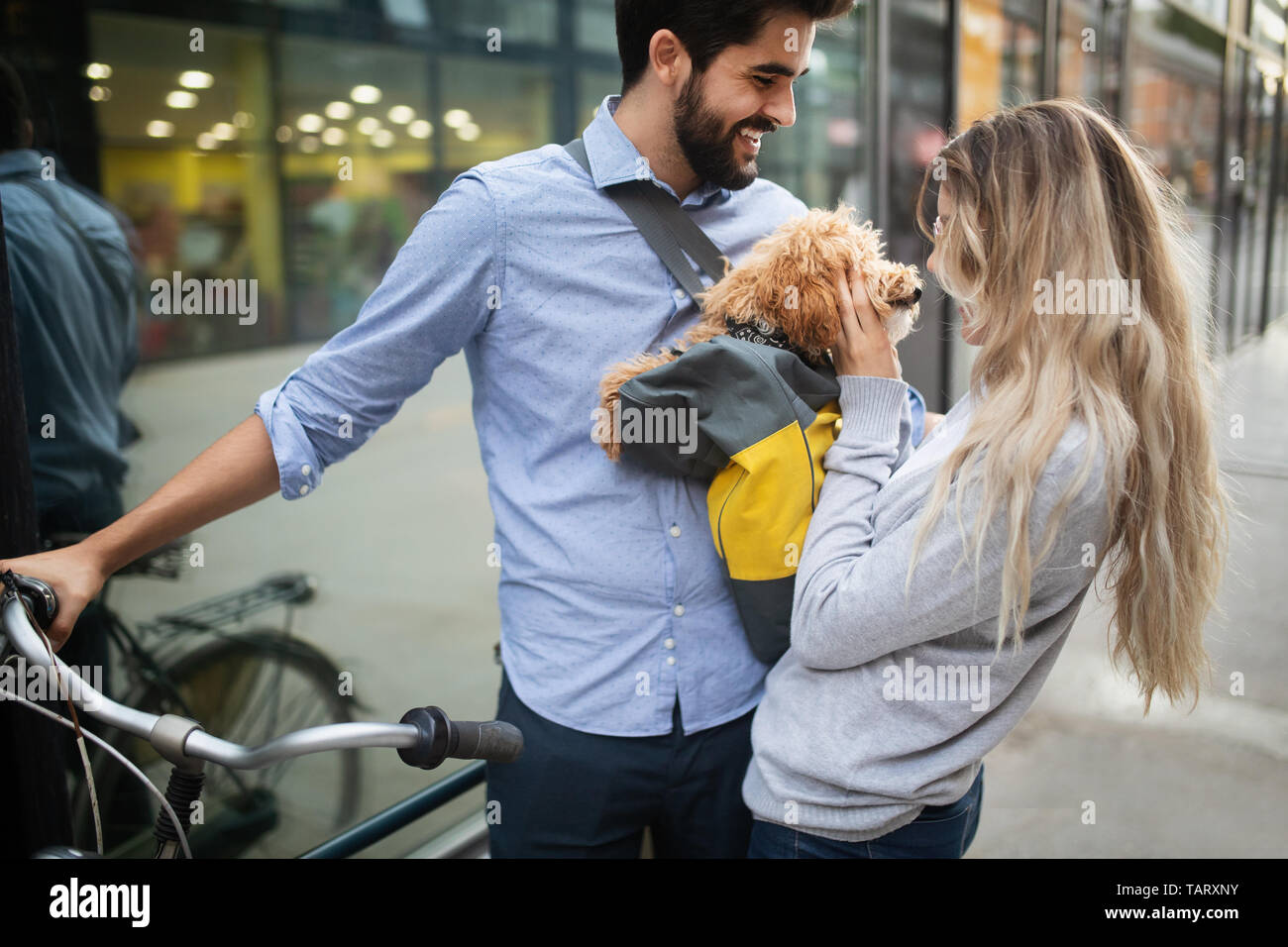 Couple in love with dog walking and smiling outdoor Stock Photo - Alamy