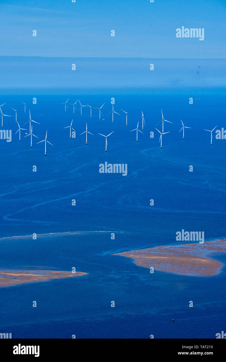 Off shore Windfarm off the mouth of the river Mersey, North West England, UK, with a Microlite flying above Stock Photo