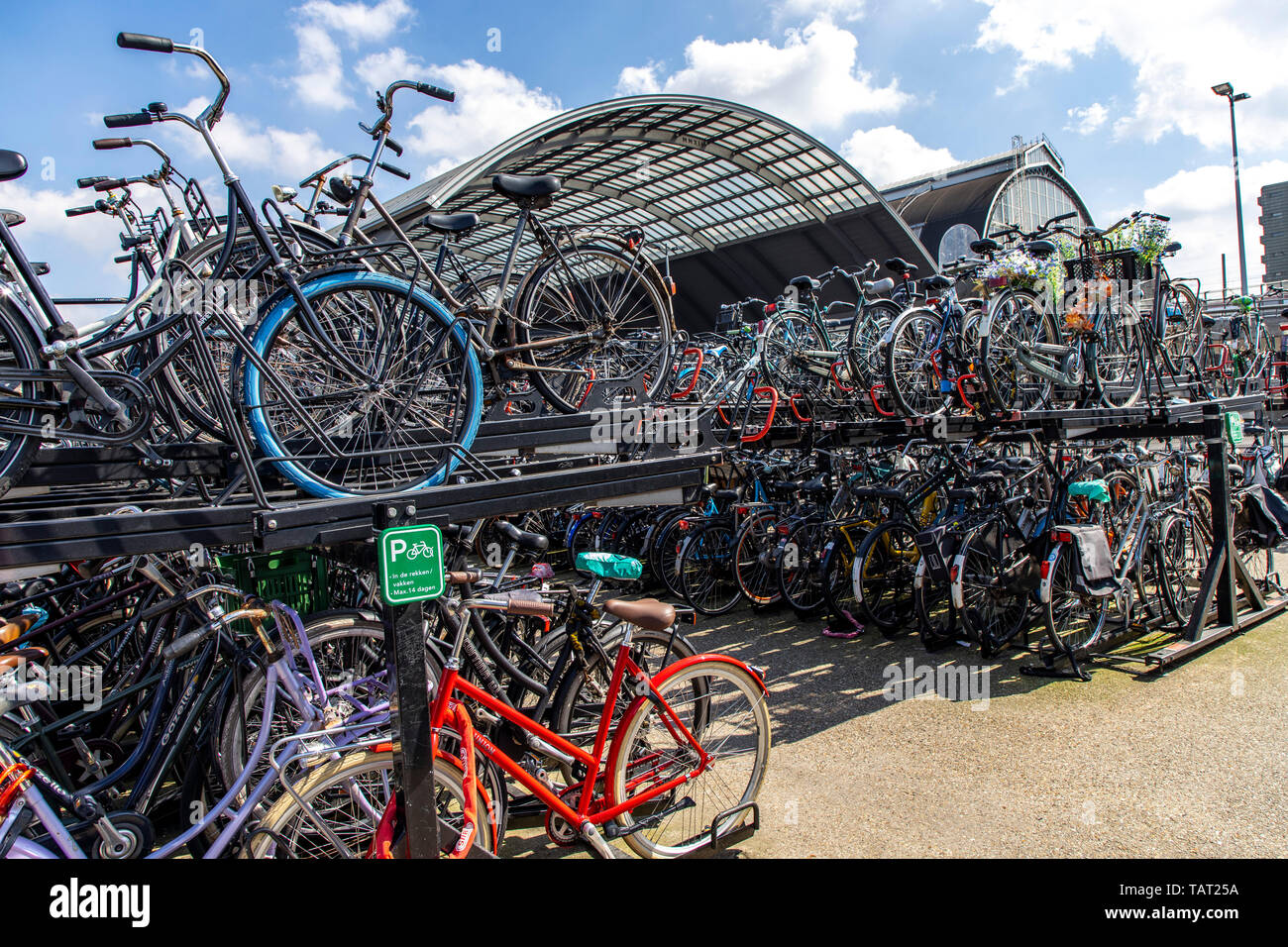 Amsterdam bicycle parking garage hi-res stock photography and