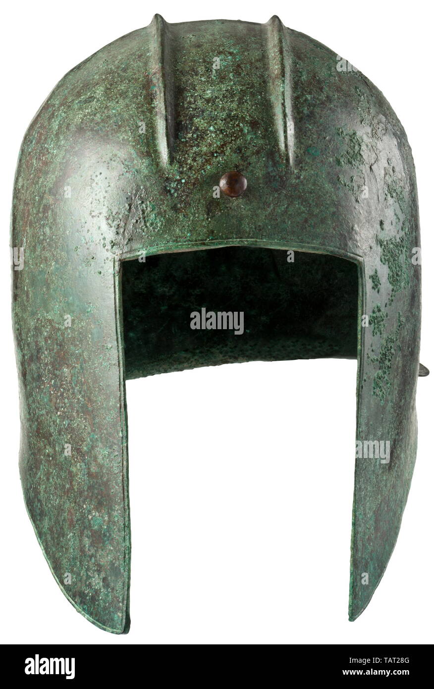 An Illyrian helmet, type III with smooth rim, mid-6th - 5th century BC, Skull made of thick sheet bronze with a smooth rim and a circular line incised alongside it. Face cutout with straight edges. The curved cheek pieces terminate into pointed cutouts which slope to a narrow, horizontal neck guard. Across the crown a hammered crest rail for the plume, laterally bordered by high, pointed mouldings. The front end of the rail with mushroom-shaped rivet, the rear end with eyelet to fasten the plume. Apart from a distinct crack at the edge on the rig, Additional-Rights-Clearance-Info-Not-Available Stock Photo