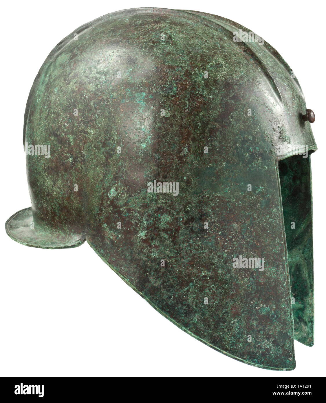 An Illyrian helmet, type III with smooth rim, mid-6th - 5th century BC, Skull made of thick sheet bronze with a smooth rim and a circular line incised alongside it. Face cutout with straight edges. The curved cheek pieces terminate into pointed cutouts which slope to a narrow, horizontal neck guard. Across the crown a hammered crest rail for the plume, laterally bordered by high, pointed mouldings. The front end of the rail with mushroom-shaped rivet, the rear end with eyelet to fasten the plume. Apart from a distinct crack at the edge on the rig, Additional-Rights-Clearance-Info-Not-Available Stock Photo