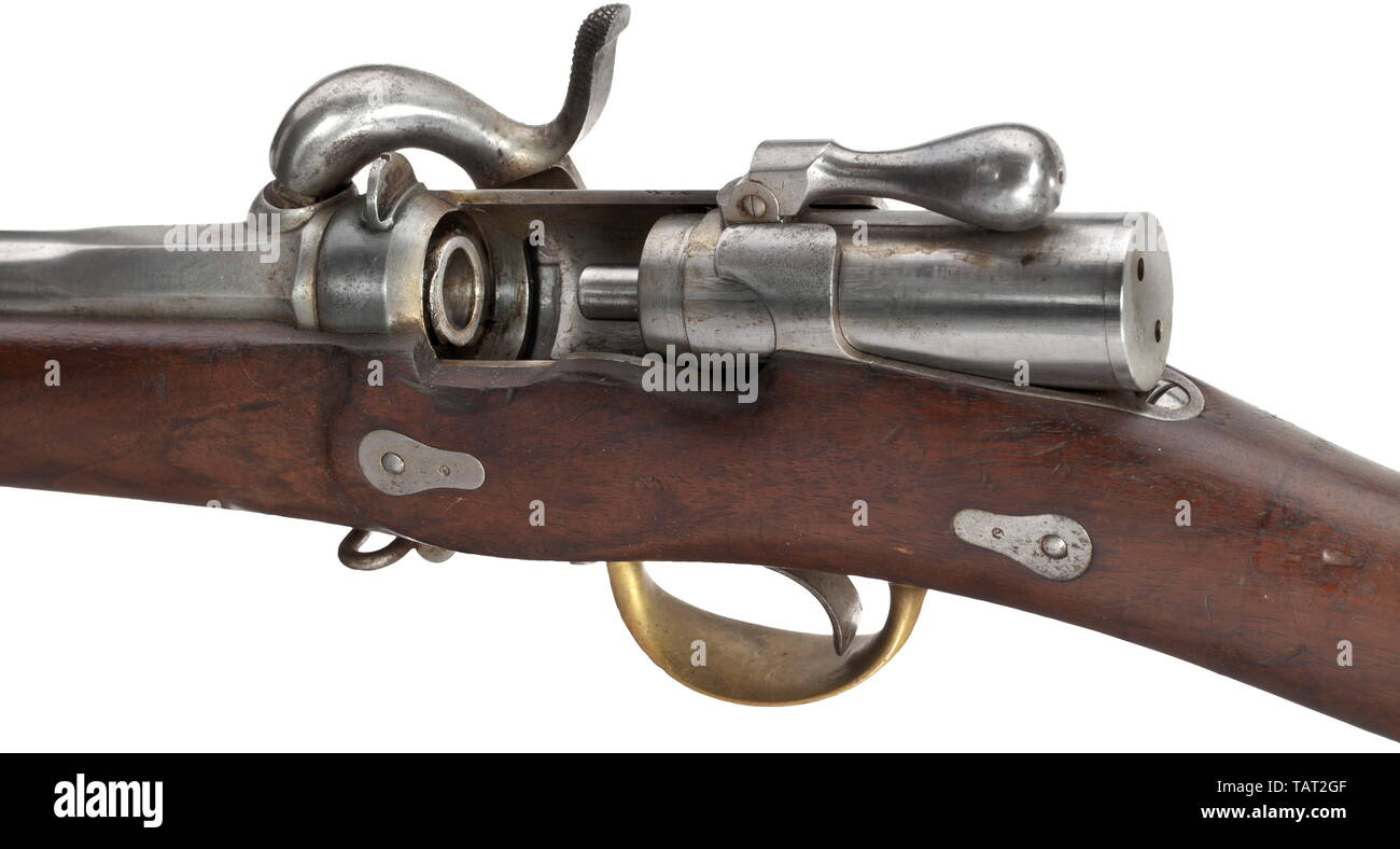 A cavalry musketoon, Arcelin system 1856, Rifled, slightly matt barrel with flat grooves in 12 mm calibre, breechloader with spring-loaded folding bolt handle. Back-action percussion lock, the lock plate with manufacturer's mark 'Chatellerault'. Walnut stock with stamped iron/brass furniture. Iron ramrod. Length 118 cm. Comes with the original broadsword bayonet with double-fullered, slightly patinated blade, the back of the blade also with manufacturer's mark 'Chatellerault'. Brass knuckle-bow hilt with bayonet mountings and leather-covered grip, Additional-Rights-Clearance-Info-Not-Available Stock Photo