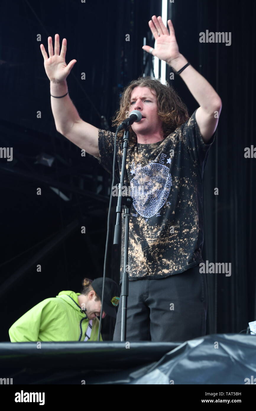 Singer Brendan Yates is shown performing on stage during a 