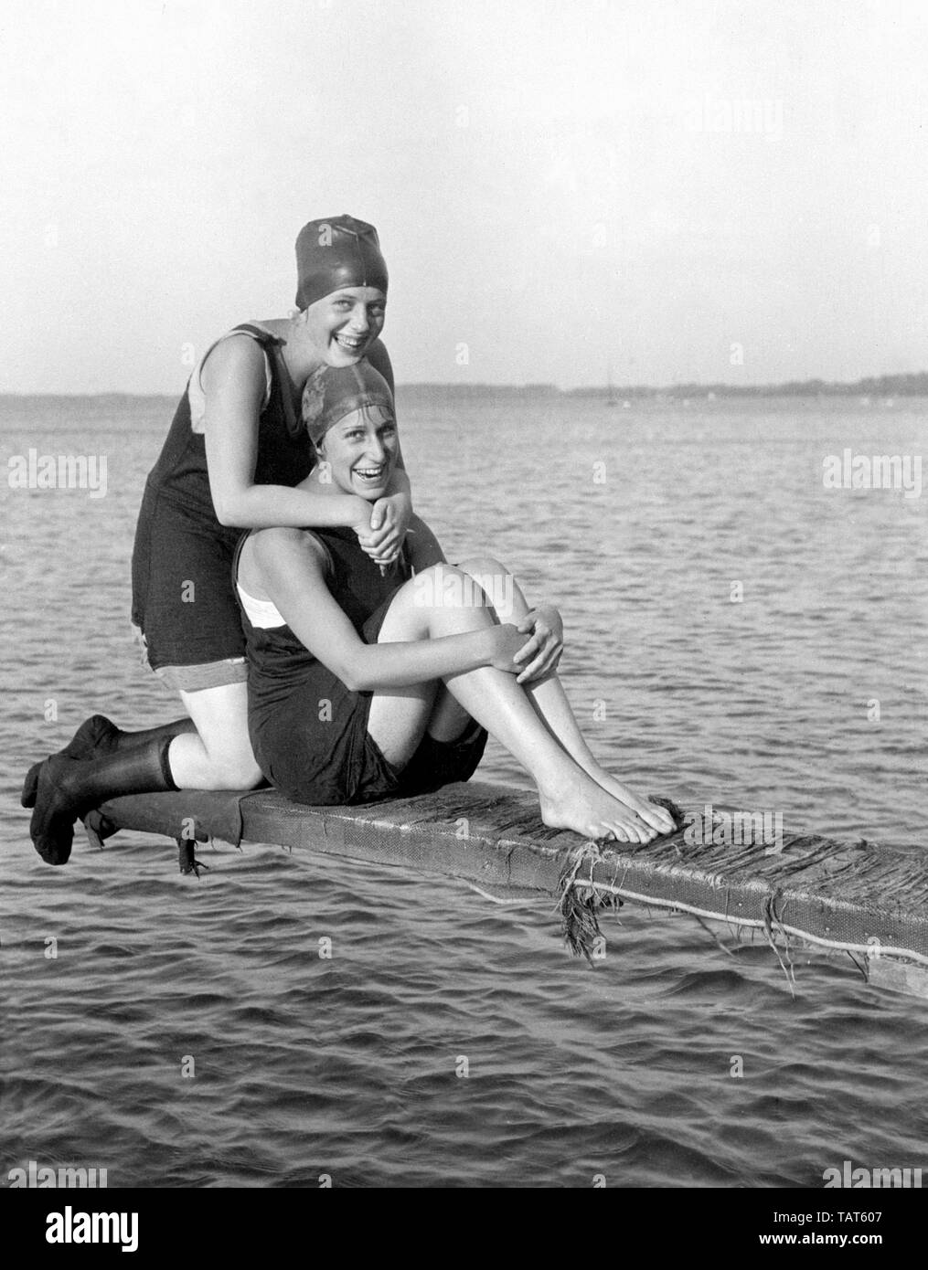 Two young women pose on Lake Mendota in Madison, Wisconsin, ca. 1925