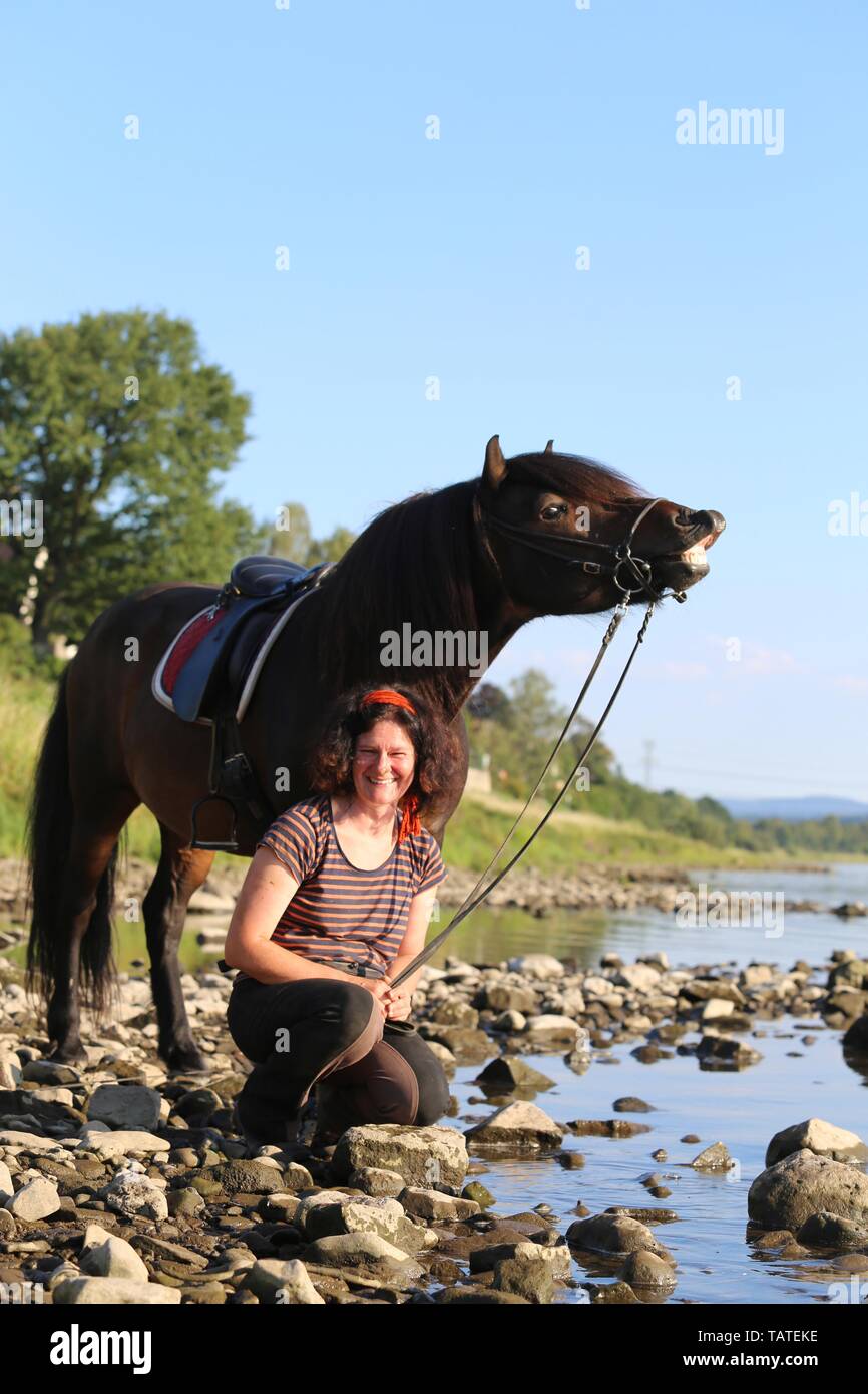 woman and Icelandic Horse Stock Photo