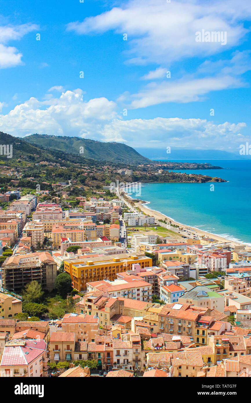Stunning view of coastal city Cefalu in Sicily, Italy captured on a vertical picture. The city on Tyrrhenian coast surrounded by rocky hills Stock Photo