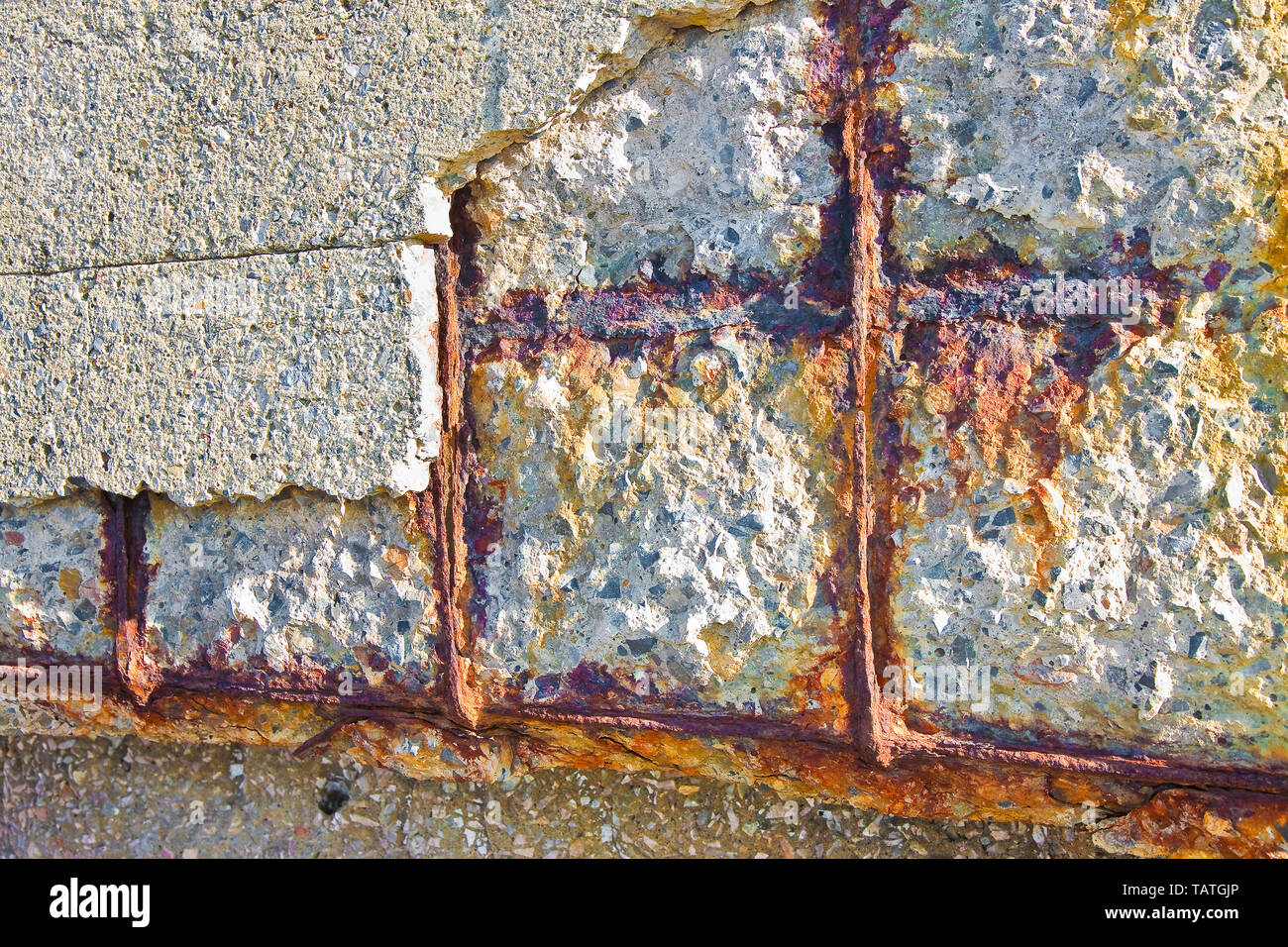 Reinforced concrete with damaged and rusty metallic reinforcement Stock