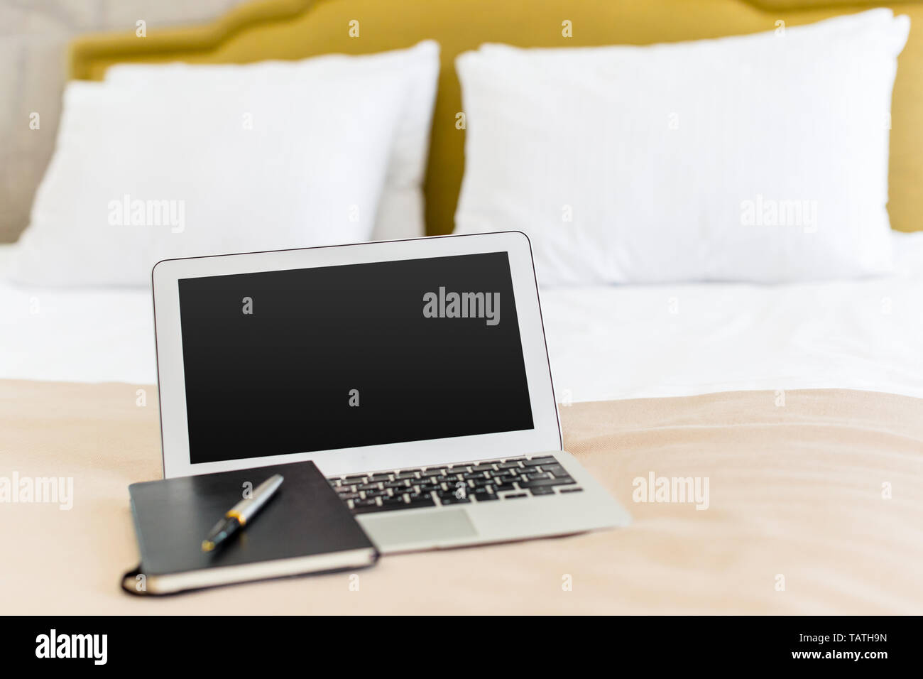 laptop on bed, notebook on bed Stock Photo Alamy