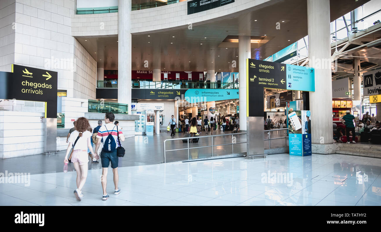 Lisbon, Portugal - August 7, 2018: Interior view of Lisbon International Airport where travelers walk on a summer day Stock Photo