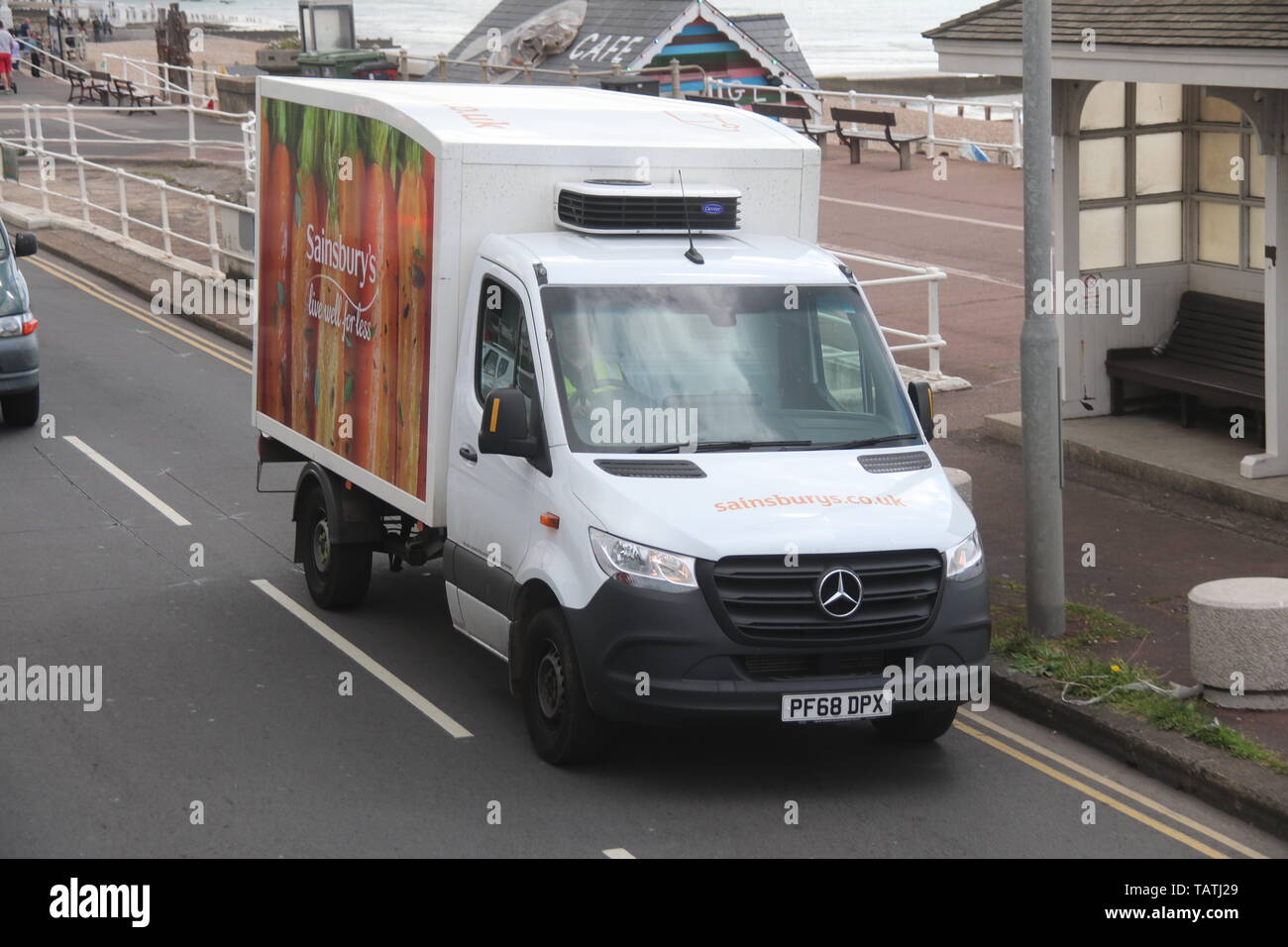 A SAINSBURY S MERCEDES BENZ SPRINTER HOME DELIVERY VAN TRAVELLING ALONG sainsbury-s-receipt-template-1