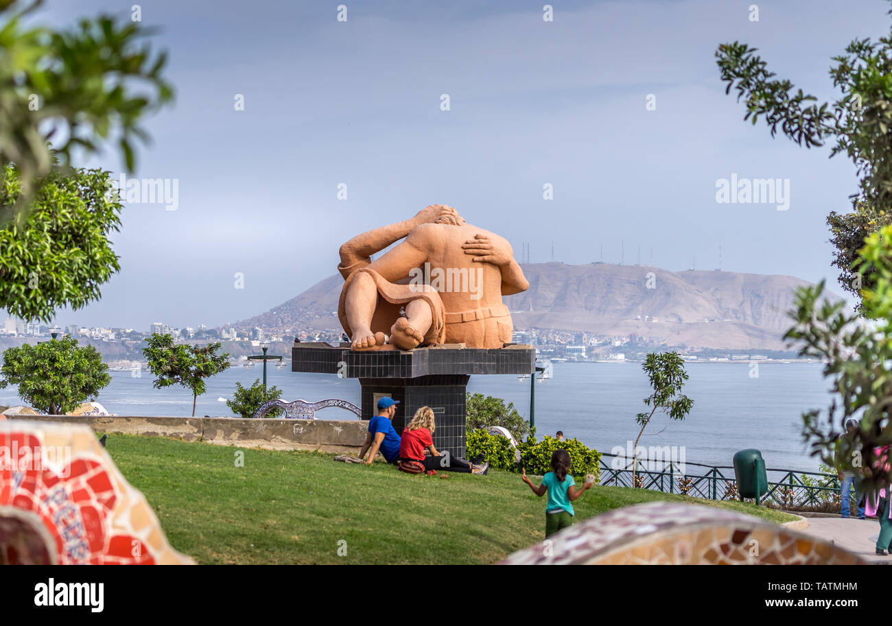 Lima, Peru  - April 29, 2019. Kiss Sculpture in Love Park Lima. People relaxing and kids playing in the park Stock Photo