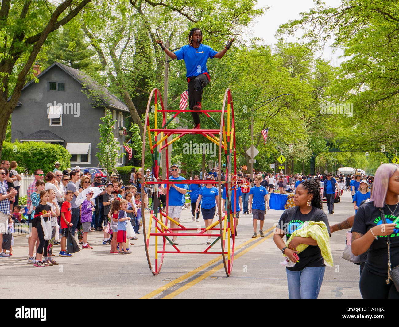 River Forest, Illinois, USA. 28th May, 2019. A wheel acrobat performs at today's Memorial Day Parade in this suburb west of Chicago. Stock Photo