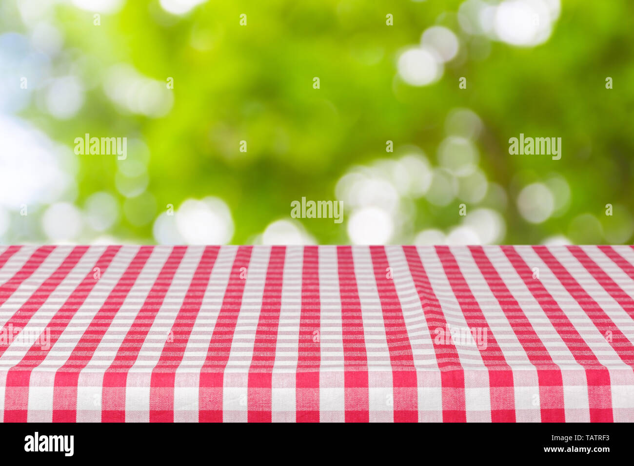 Background with tablecloth on wooden table Stock Photo