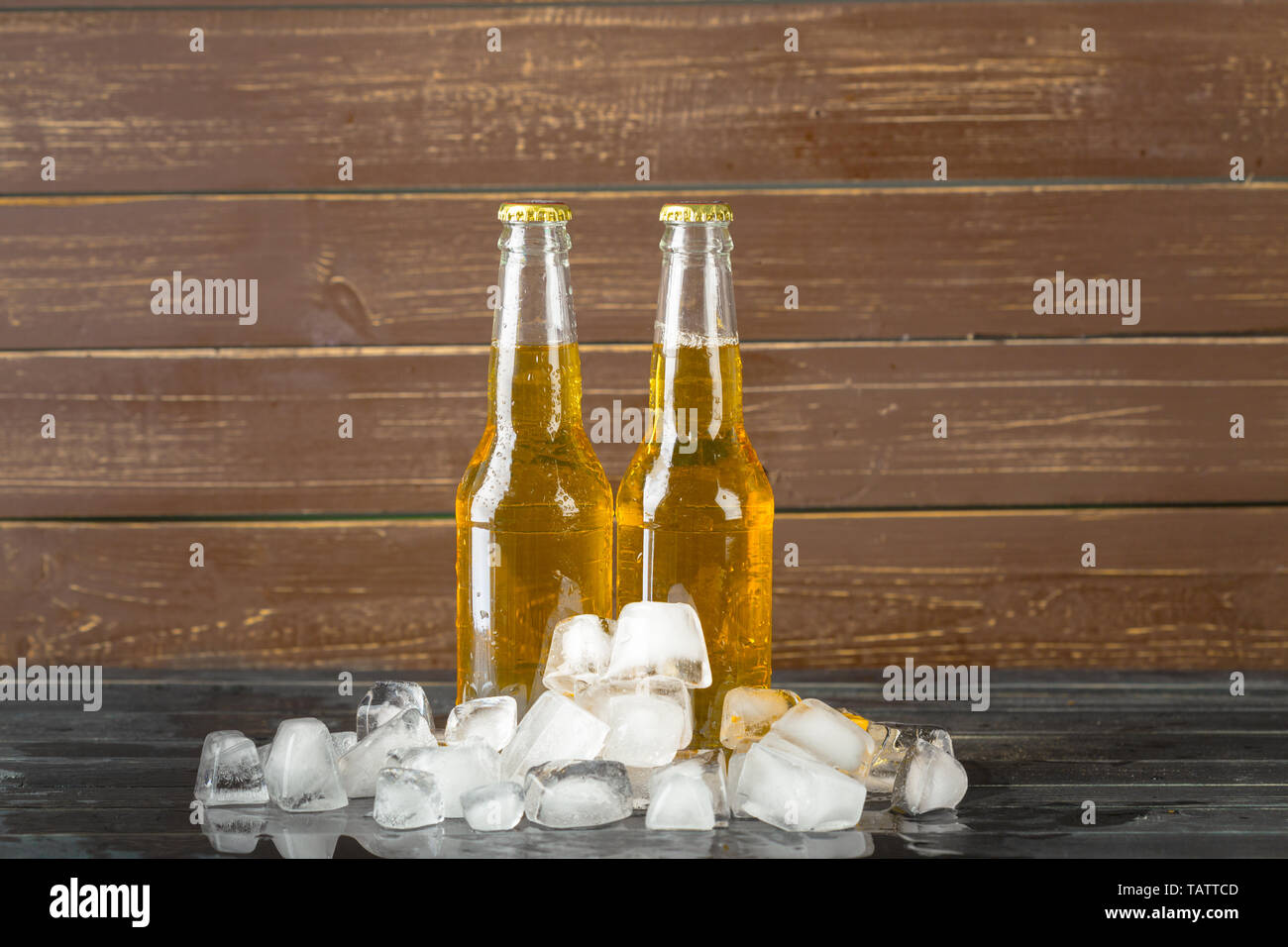 Bottles of cold and fresh beer with ice Stock Photo Alamy