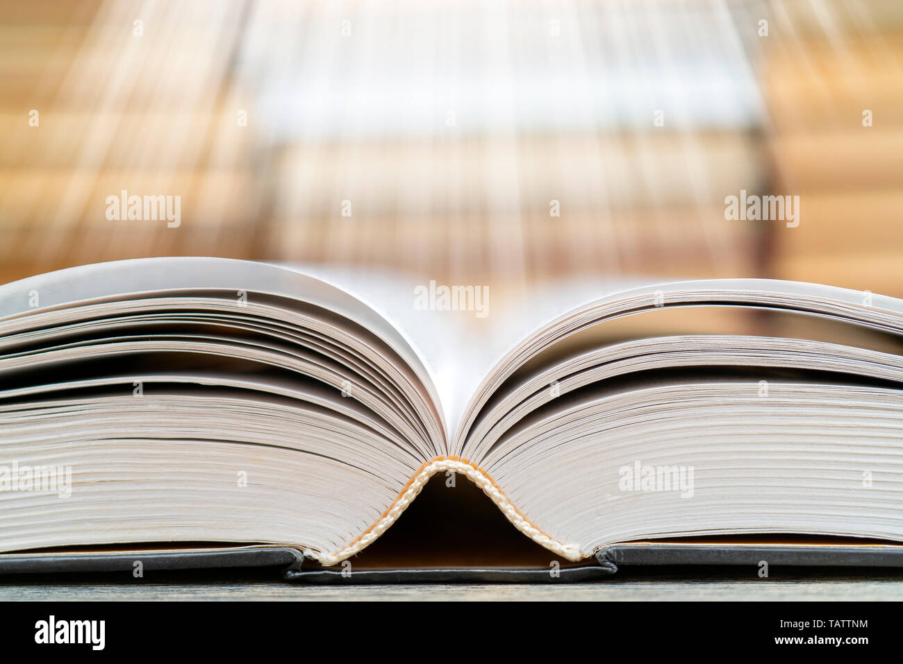 Book pages emit light. Symbol of wisdom, knowledge and learning Stock