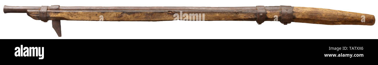 A late Gothic wall gun, Nuremberg, circa 1520, Round and smooth, long barrel in 26 mm calibre with swamped muzzle. Powder pan on the side integrated into dovetail with typical early Renaissance ornaments, original pan cover missing. Original oak post stock 'in the white' with three original, forged iron bands. On muzzle wrought-iron hook tapering towards the bottom and fixed to barrel by one band. On right side deeply stamped maker's mark: Gothic minuscule 'P' inside square shield. Length 212 cm. Provenance: Hermann Historica, 29th auktion (1993), Additional-Rights-Clearance-Info-Not-Available Stock Photo