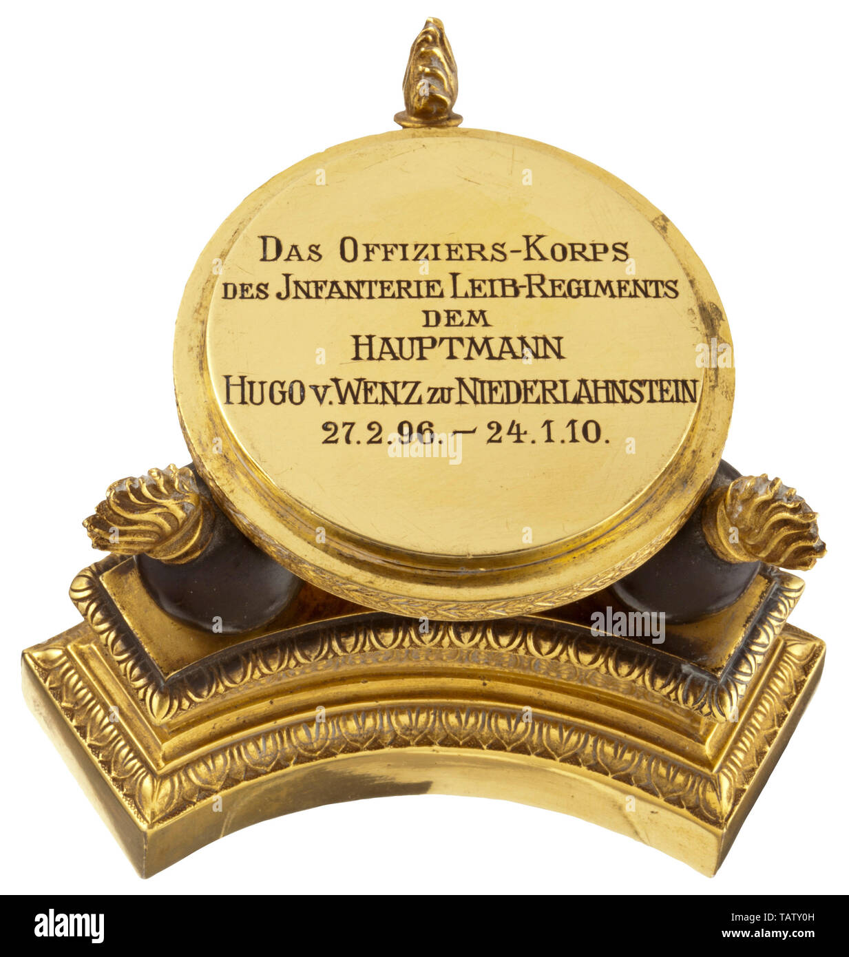 Generalmajor Hugo von Wenz zu Niederlahnstein - an officer's gift presented by the Infantry Lifeguards Regiment 1910, The dedication plaque bearing the inscription 'DAS OFFIZIERS-KORPS DES INFANTERIE LEIB-REGIMENTS DEM HAUPTMANN HUGO V. WENZ ZU NIEDERLAHNSTEIN 27.2.96. - 24.1.10' is supported by three grenades mounted in dark-coloured bronze and fitted on a three-pronged, fire-gilt bronze plinth, engraved with the registration number '63'. On top is the silver drinking cup with a gilt interior, shaped like an officer's grenadier cap from the time, Additional-Rights-Clearance-Info-Not-Available Stock Photo