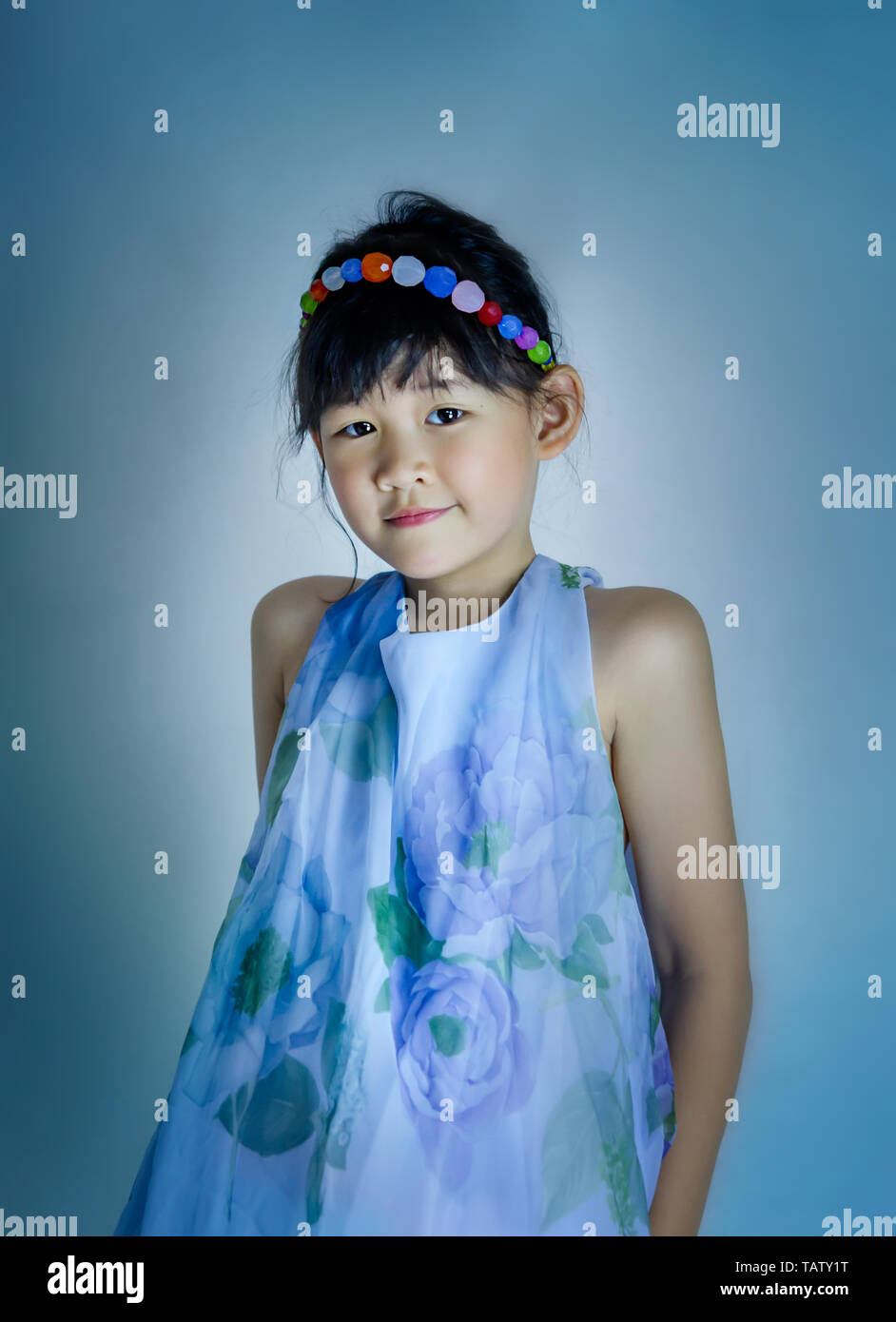 portrait of asian little girl in blue dress Stock Photo - Alamy