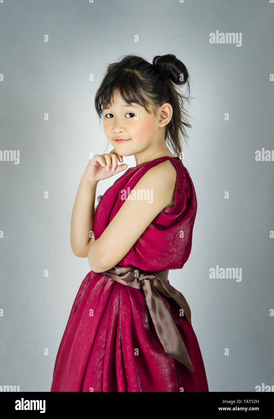 Portrait of asian little girl in red dress Stock Photo - Alamy