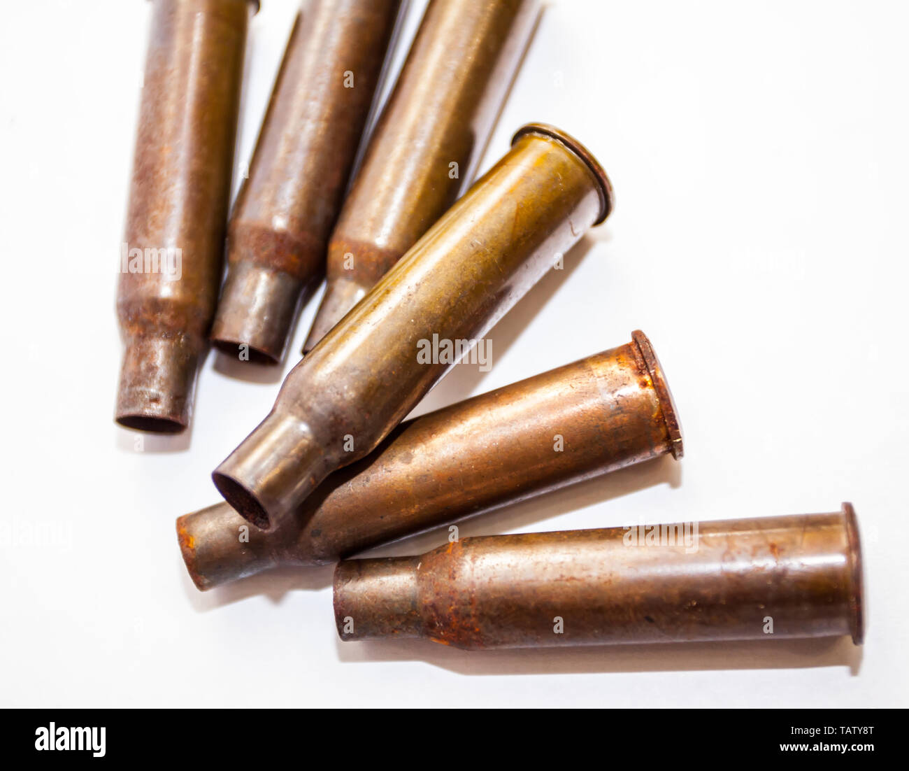 Empty bullet shells on a white background Stock Photo - Alamy