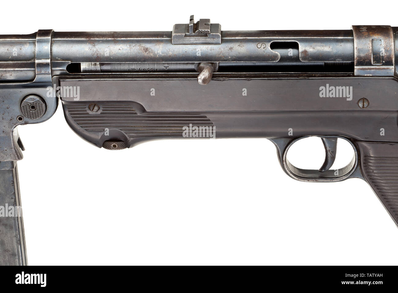 An original machine pistol Mod. 40 (MP 40), 1st issue, code 'ayf 41', Cal. 9 mm parabellum, no. 6369c. Matching numbers except for the breech. Bright bore. 32-shot. Fixed sight with one flap, scaled 100 - 200. First issue: smooth magazine well, hooked bolt handle. Marked 'MP 40 / ayf / 41' on the casing, 1941 production series by Erma, Erfurt. Acceptance mark eagle/WaA280 with further markings by the supplier. Original finish with signs of usage, partially stained and patinated. Stock and grip plates made of dark brown Bakelite. Original strap. C, Additional-Rights-Clearance-Info-Not-Available Stock Photo