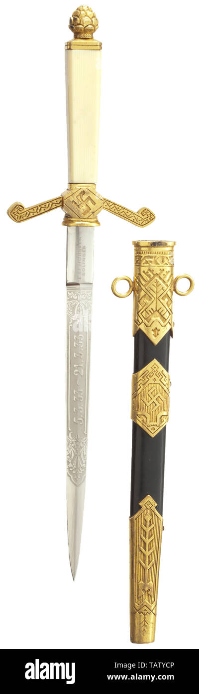 An honour dagger commemorating the Reichstag elections on 5 March 1933, Nickel-plated iron blade with decorative etching '5.3.33 - 21.3.33' and motto 'Ehre - Freiheit - Vaterland' (tr. Honour - Freedom - Fatherland), Weimar eagle and manufacturer's mark 'E. & F. Hörster, Solingen', the tang with punch number '3'. Unscrewable brass pommel in the shape of a pine cone, rectangular plastic grip, quillons decorated with floral ornaments and central swastika, mostly with punch number '3'. Iron scabbard lacquered in black, with gilt brass fittings, richly decorated. The mounts als, Editorial-Use-Only Stock Photo