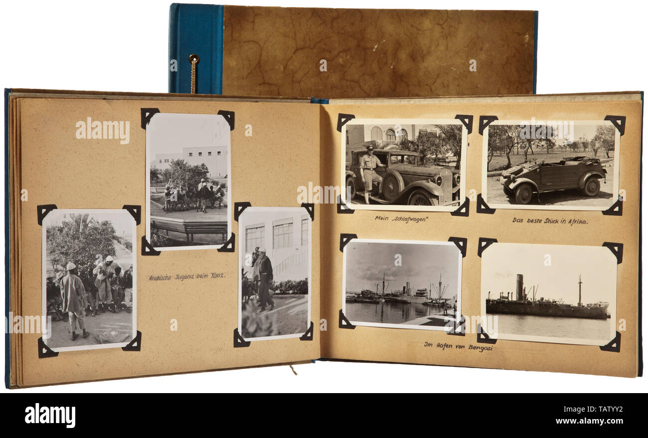 Two photograph albums of a Luftwaffe signal unit, Captioned, with over 200  photographs, mainly taken in North Africa. The front flyleaf of each album  with colour drawing. Documentary photographs of the special