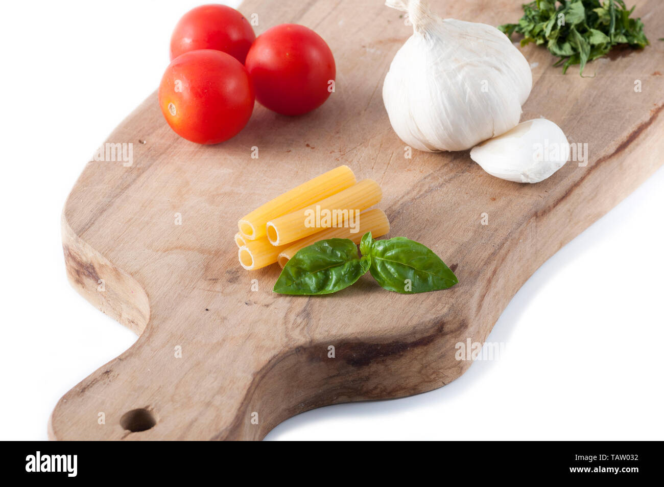 ingredients to cook a pasta with tomato sauce and extra virgin olive Stock Photo