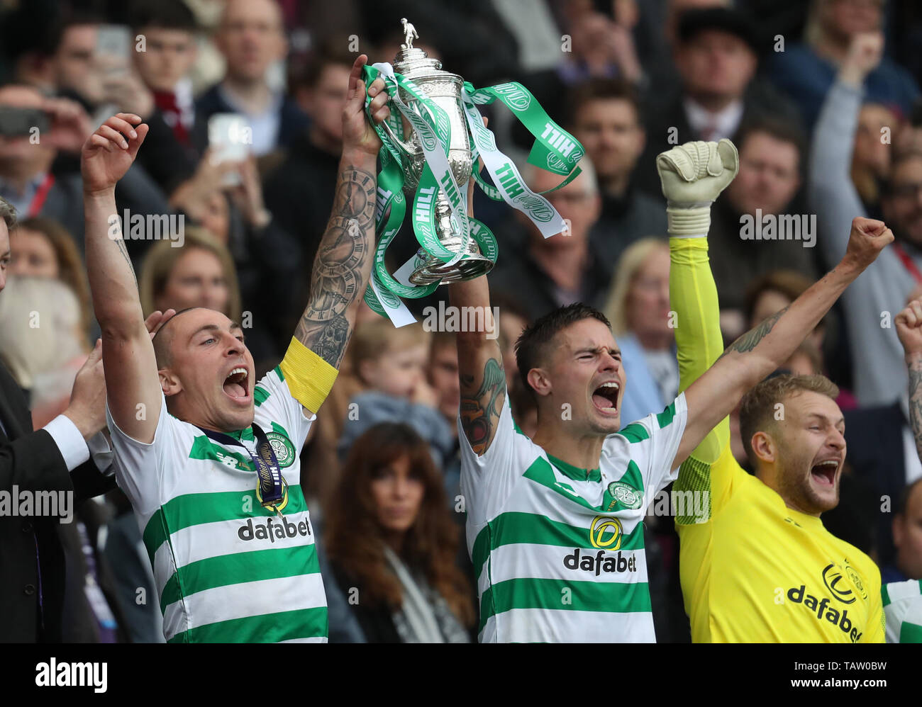 Celtic's Scott Brown and Michael Lustig lift the cup during the William Hill Scottish Cup Final at Hampden Park, Glasgow. Stock Photo