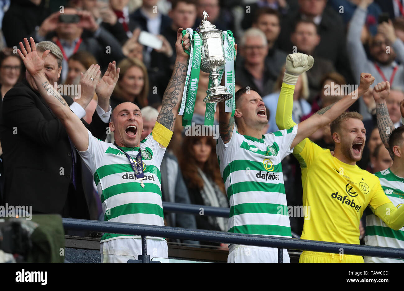 Celtic's Scott Brown and Michael Lustig lift the cup during the William Hill Scottish Cup Final at Hampden Park, Glasgow. Stock Photo