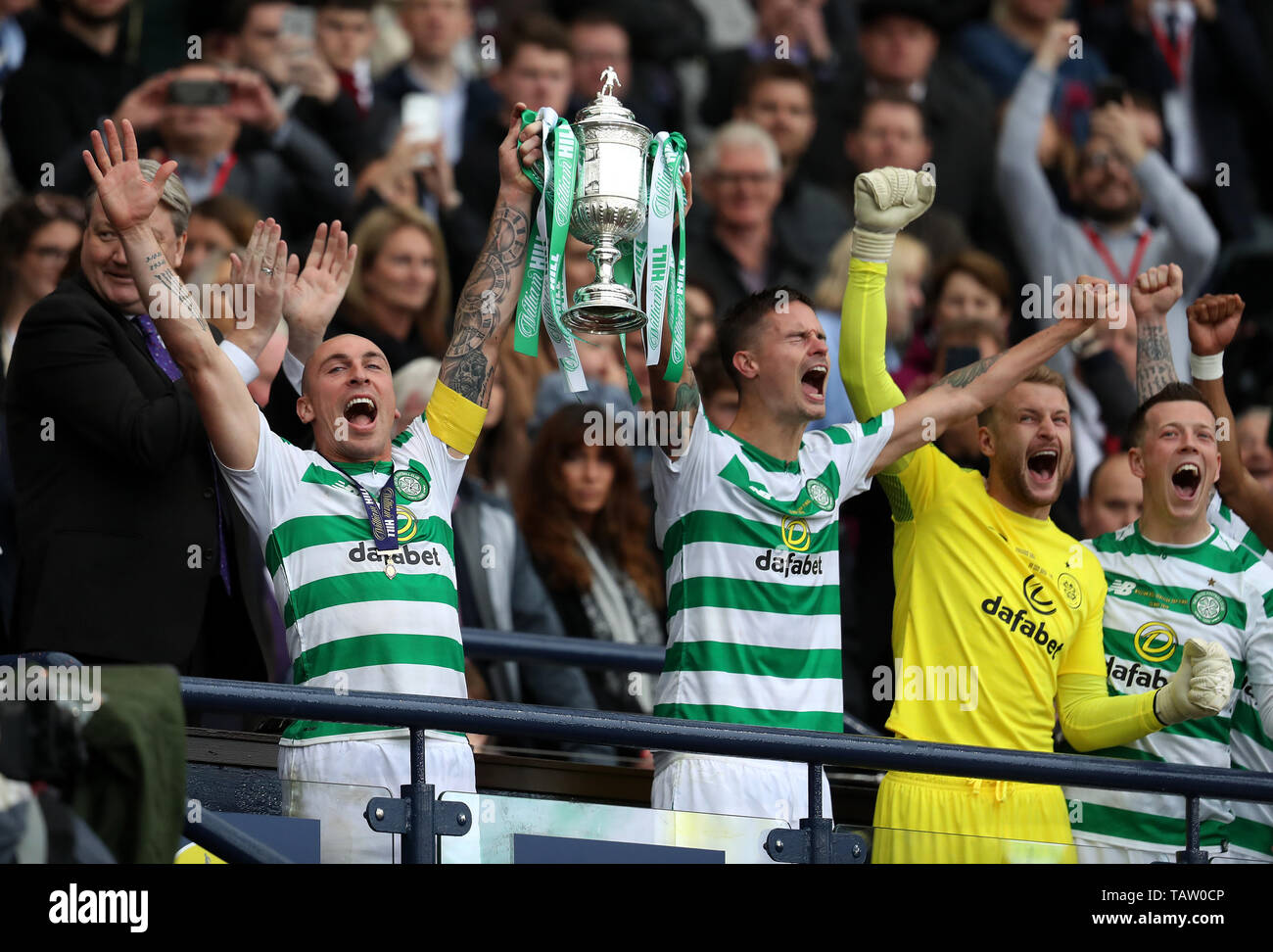 Celtic's Scott Brown and Michael Lustig lift the cup during the William Hill Scottish Cup Final at Hampden Park, Glasgow. Stock Photo