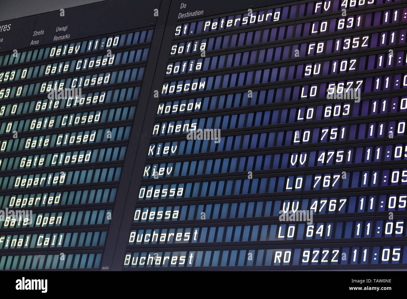 WARSAW, POLAND - AUGUST 31: Airport departures board on August 31, 2010 at Warsaw Chopin airport, Poland. With 8.7 million passengers for 2010, it is  Stock Photo