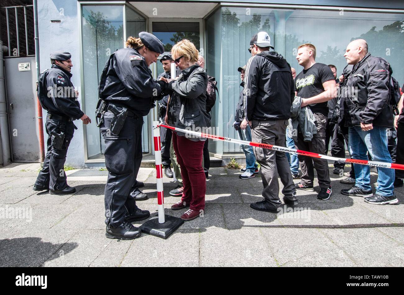 Dortmund, Nordrhein Westfalen, Germany. 25th May, 2019. Neonazis in Dortmund, Germany arrive for a demonstration where there were checks by police commandos for weapons and contraband. Prior to the European Elections, the neonazi party Die Rechte (The Right) organized a rally in the German city of Dortmund to promote their candidate, the incarcerated Holocaust denier Ursula Haverbeck. The demonstration and march were organized by prominent local political figure and neonazi activist Michael Brueck (Michael BrÃ¼ck) who enlisted the help of not only German neonazis, but also assistance from Ru Stock Photo