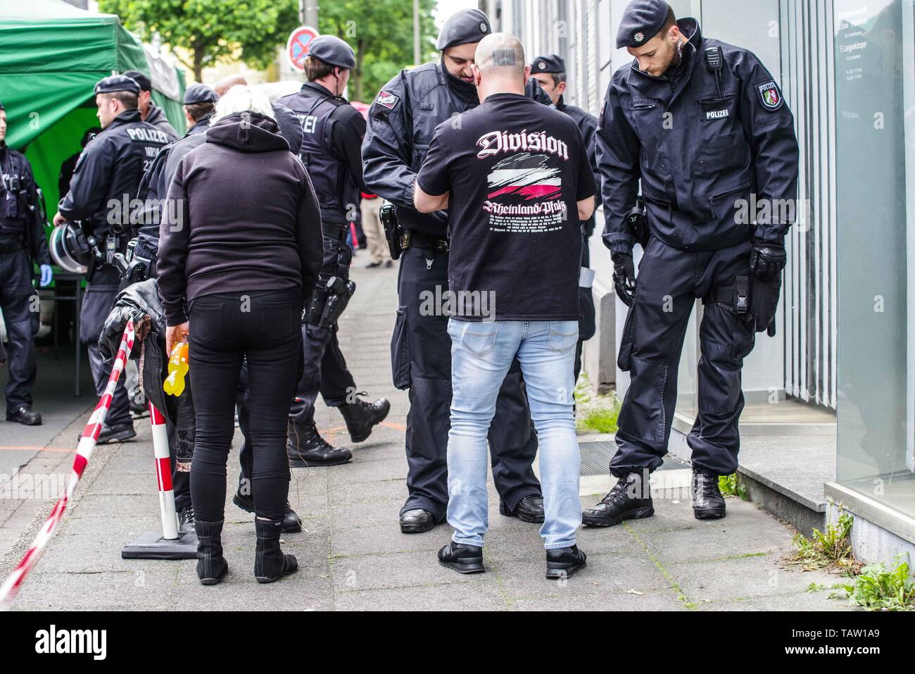 Dortmund, Nordrhein Westfalen, Germany. 25th May, 2019. Neonazis in Dortmund, Germany arrive for a demonstration where there were checks by police commandos for weapons and contraband. Prior to the European Elections, the neonazi party Die Rechte (The Right) organized a rally in the German city of Dortmund to promote their candidate, the incarcerated Holocaust denier Ursula Haverbeck. The demonstration and march were organized by prominent local political figure and neonazi activist Michael Brueck (Michael BrÃ¼ck) who enlisted the help of not only German neonazis, but also assistance from Ru Stock Photo