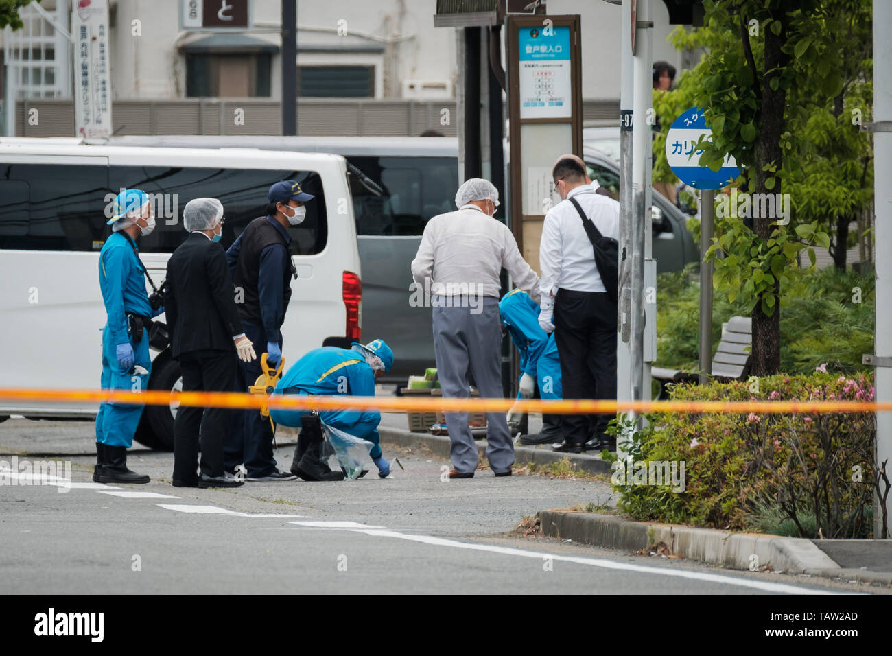 Forensic police officers from Kanagawa prefecture search for evidence ...