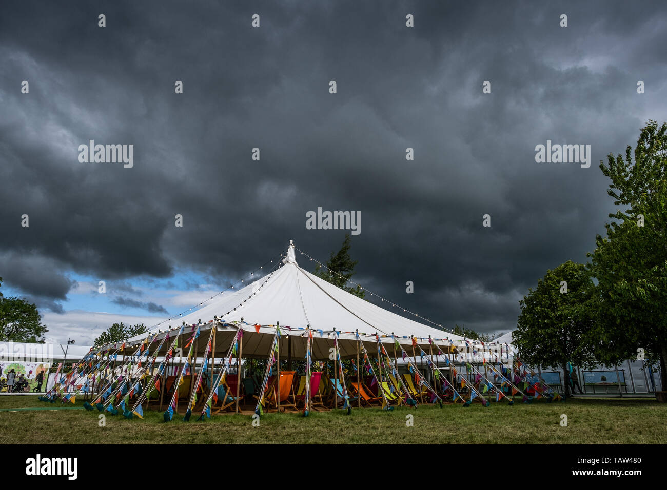 The Hay Festival, Hay on Wye, Wales UK, Tuesday 28th May 2019. Dark looming storm clouds tower over one of the marquees at the 32nd annual Hay Festival of Literature and the Arts. The festival, held every year in the small town of Hay on Wye on the Wales - England border, attracts the finest writers, politicians and intellectuals from across the globe for 10 days of celebration of the best of the written word and critical debate Photo Credit: Keith Morris/Alamy Live News Stock Photo