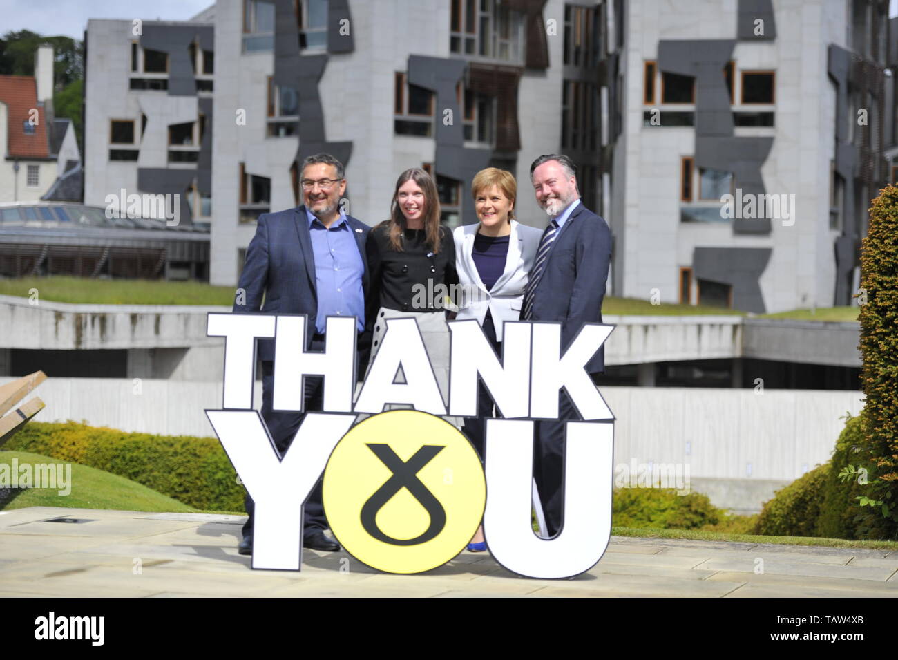 Edinburgh, UK. 28th May, 2019. PICTURED: (left-right) Christian Allard; Aileen McLEod; Nicola Sturgeon; Alyn Smith. SNP Leader Nicola Sturgeon welcomes the three newly elected SNP MEPs - Alyn Smith, Christian Allard and Aileen McLeod - following the party's emphatic victory in the European parliament elections. Ms Sturgeon said: “Scotland said no to Brexit in 2016. This emphatic result makes clear, we meant it. “These three first class SNP MEPs will work tirelessly to keep Scotland in Europe, stop Brexit and make Scotland's voice heard at every turn. Credit: Colin Fisher/Alamy Live News Stock Photo