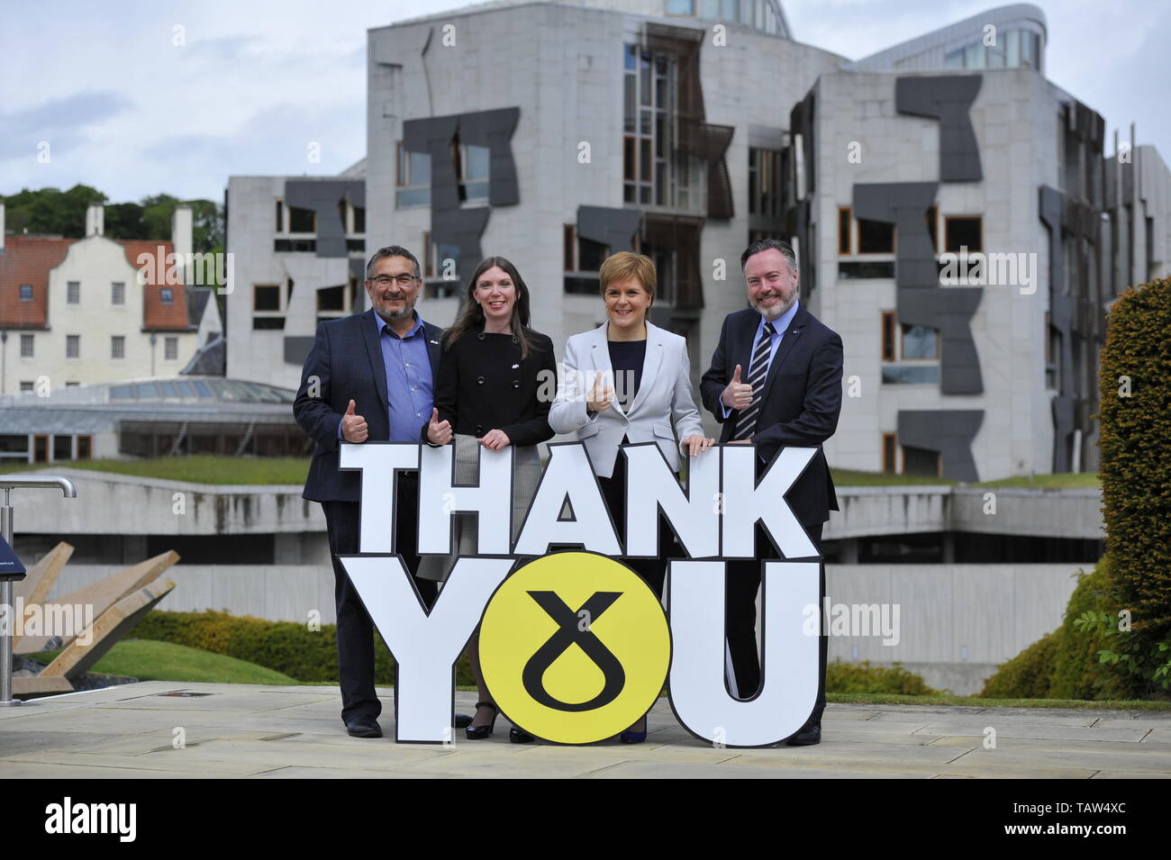 Edinburgh, UK. 28th May, 2019. PICTURED: (left-right) Christian Allard; Aileen McLEod; Nicola Sturgeon; Alyn Smith. SNP Leader Nicola Sturgeon welcomes the three newly elected SNP MEPs - Alyn Smith, Christian Allard and Aileen McLeod - following the party's emphatic victory in the European parliament elections. Ms Sturgeon said: “Scotland said no to Brexit in 2016. This emphatic result makes clear, we meant it. “These three first class SNP MEPs will work tirelessly to keep Scotland in Europe, stop Brexit and make Scotland's voice heard at every turn. Credit: Colin Fisher/Alamy Live News Stock Photo