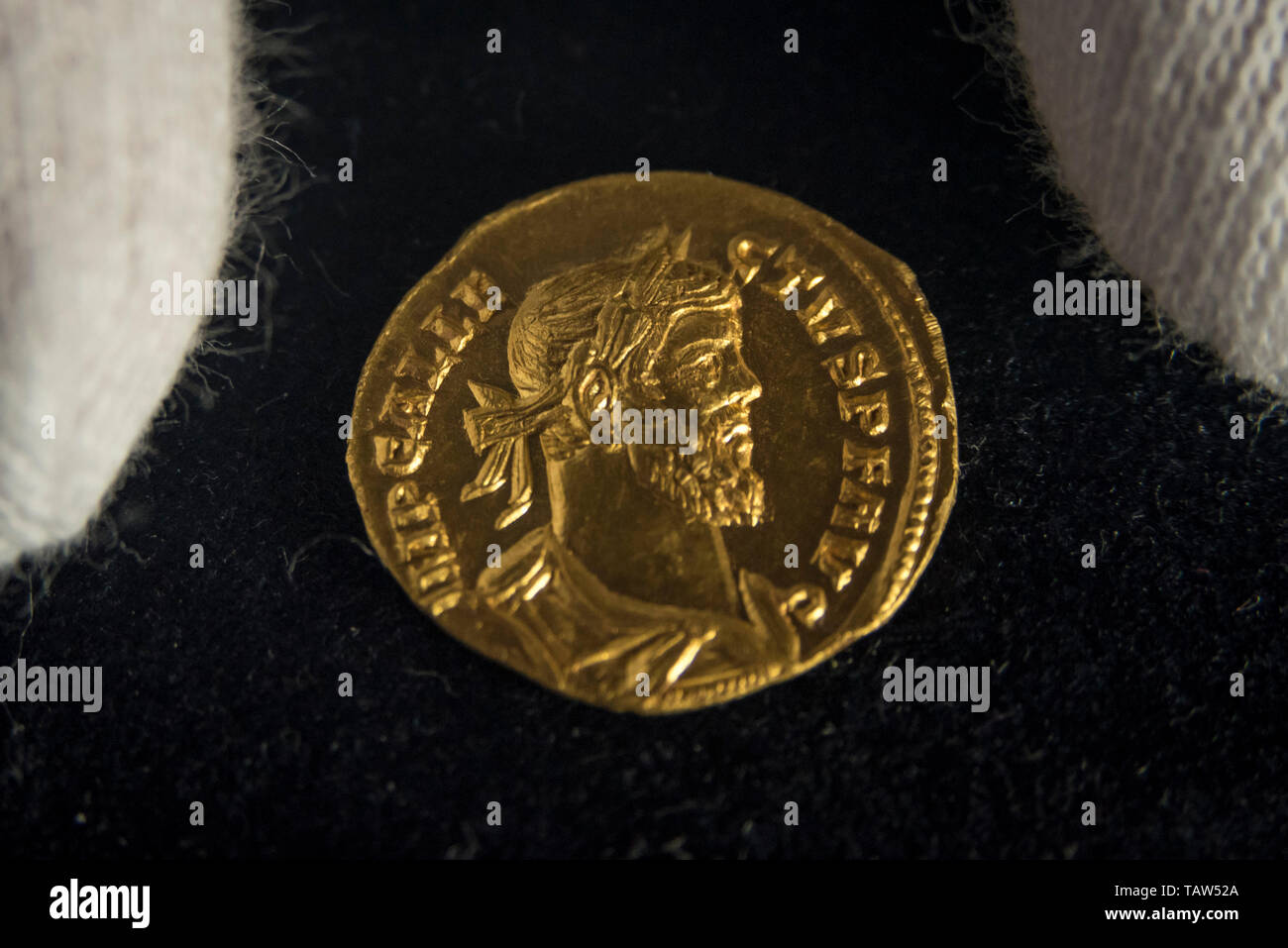London, UK.  28 May 2019. A rare Aureus - a gold coin of ancient Rome, 4.31grams in weight and about the diameter of  modern day 1 penny presented at a photocall in Mayfair at Dix Noonan Webb, international coin specialists, ahead of its auction on 6 June 2019 with an estimate at £70,000-100,000.  The coin, dating from AD 293-296, was found by a 30-year-old metal detectorist in March 2019 in a newly ploughed field in Kent, and is one of only twenty-four Aurei of Allectus known with nineteen different obverse dies recorded.  Credit: Stephen Chung / Alamy Live News Stock Photo