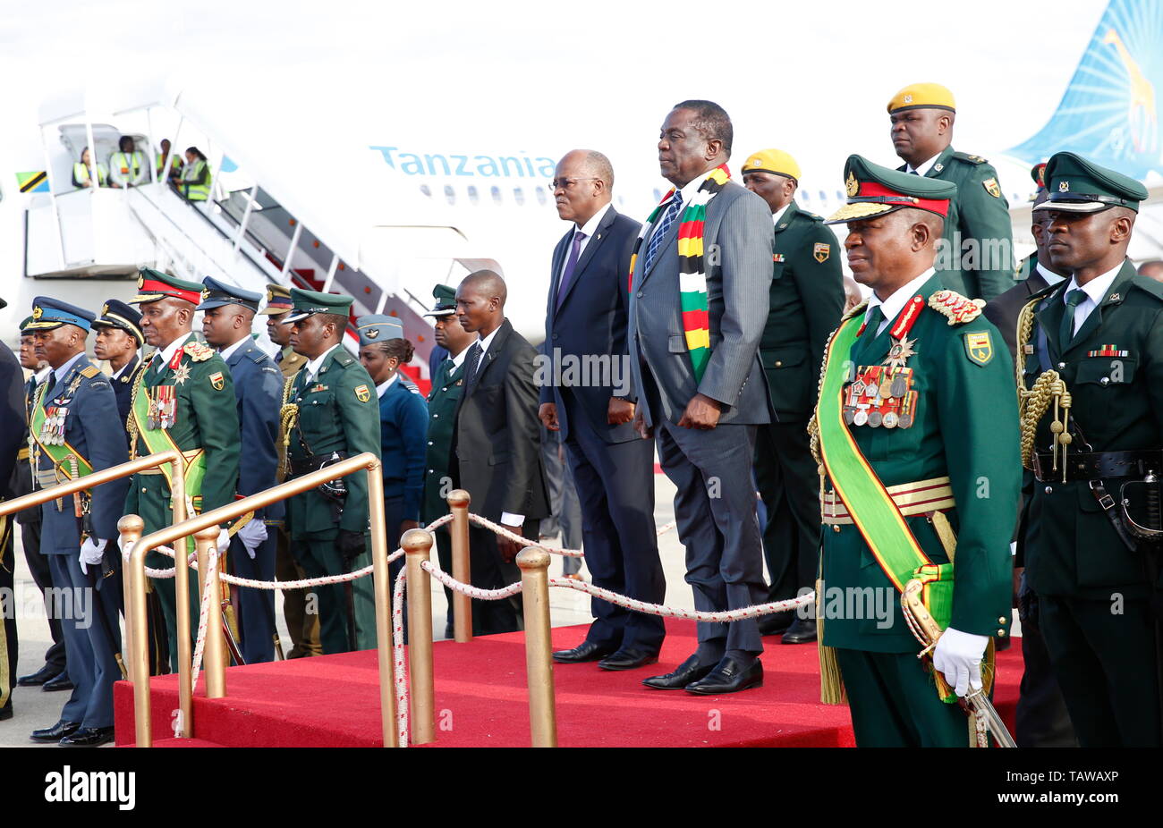 Harare, Zimbabwe. 28th May, 2019. Zimbabwean President Emmerson Mnangagwa (R, Front, on stage) welcomes Tanzanian President John Magufuli (L, Front, on stage) at the Robert Gabriel Mugabe International Airport in Harare, Zimbabwe, on May 28, 2019. Visiting Tanzanian President John Magufuli arrived in Zimbabwe on Tuesday for a two-day official visit. Credit: Shaun Jusa/Xinhua/Alamy Live News Stock Photo
