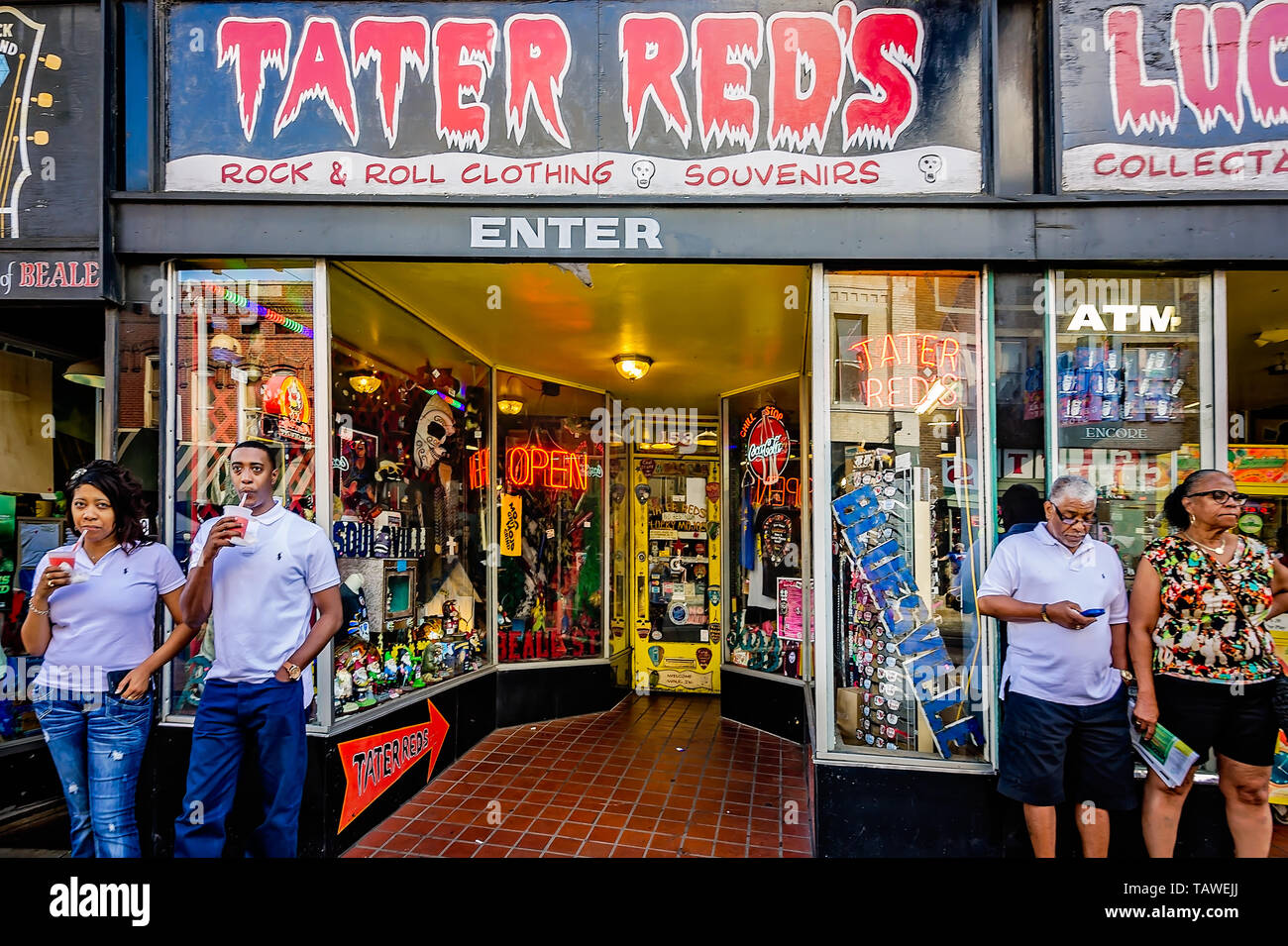 African-American tourists stand outside Tater Red's, Sept. 12, 2015, in Memphis, Tennessee. Stock Photo