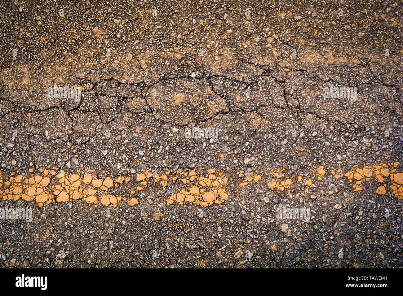 Crack asphalt old road texture background with yellow line Stock Photo ...